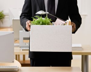 Man carrying belongings in a box