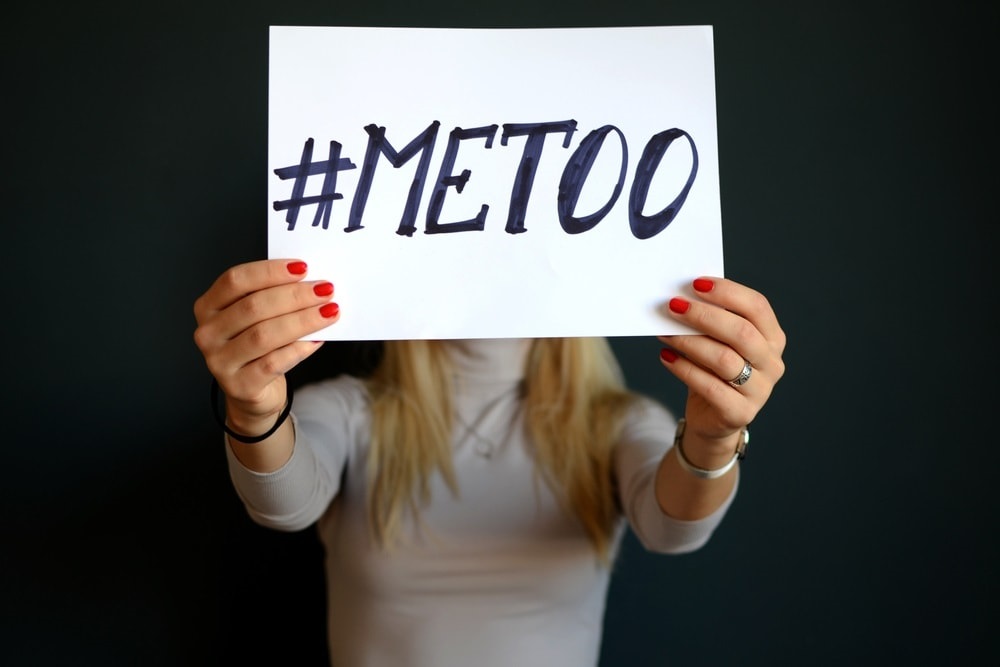 woman holding #metoo sign
