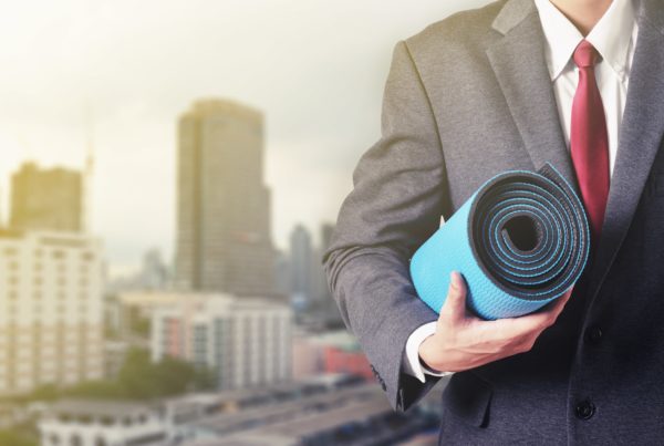 businessman with yoga mat