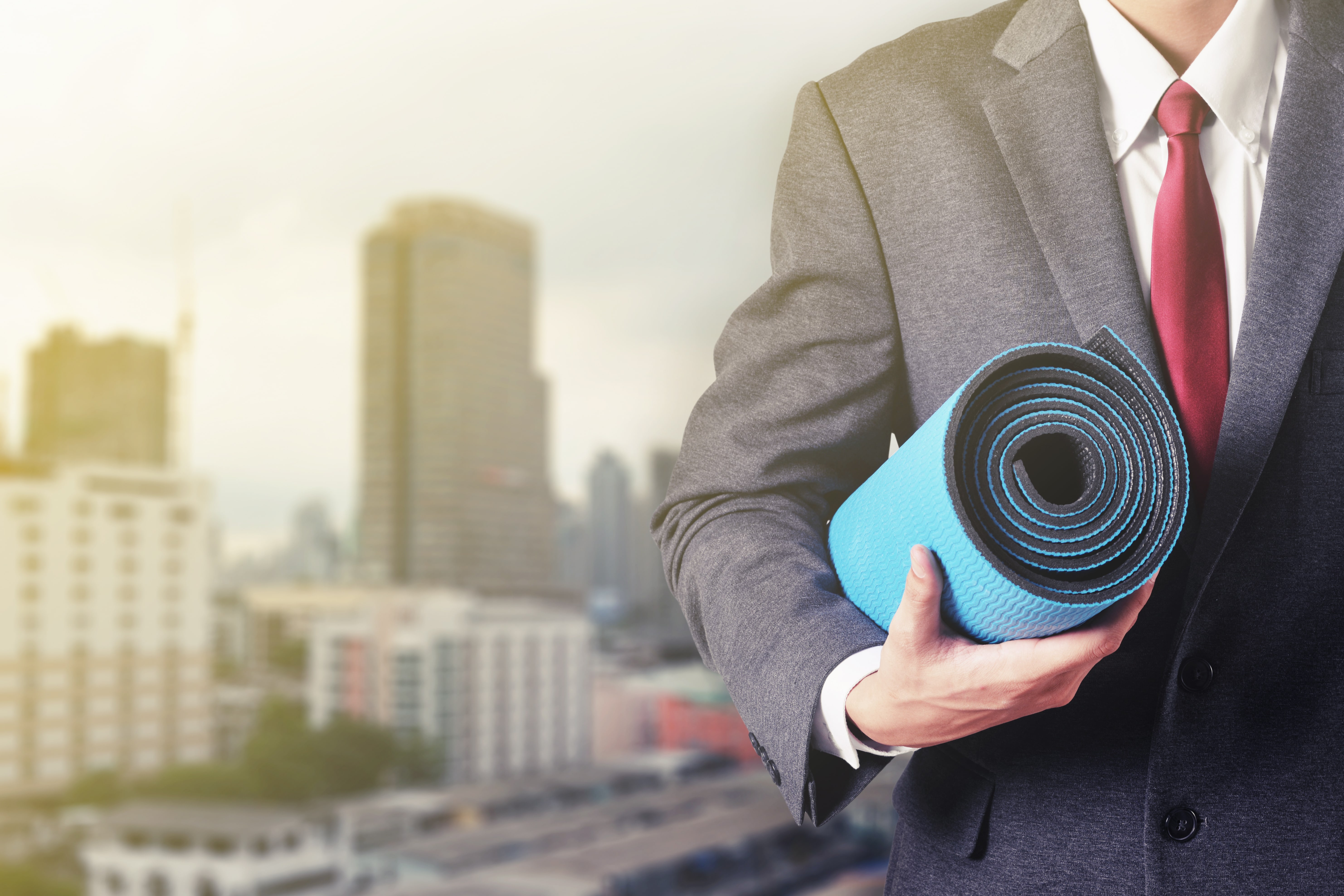 businessman with yoga mat